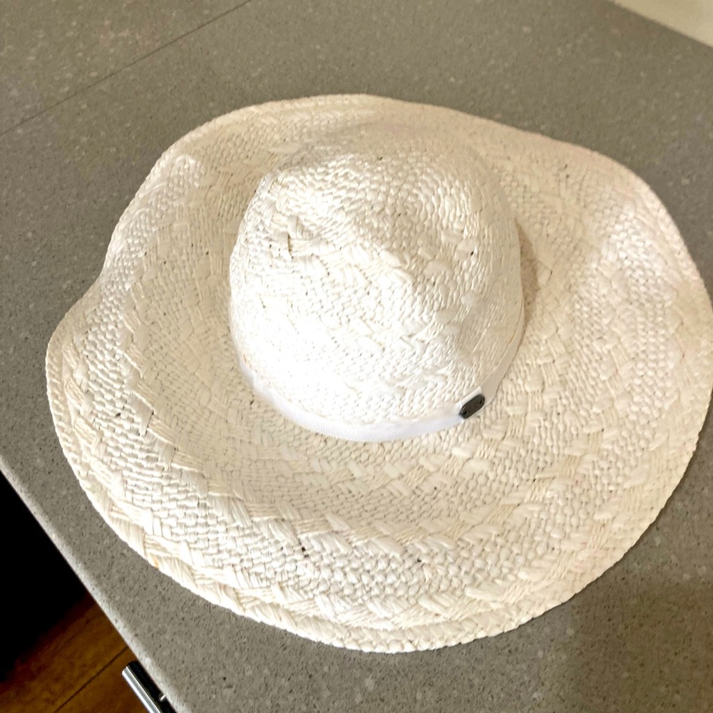 Beautiful white summer hat made of hundred percent paper.